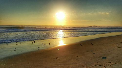 Scenic view of sea at sunset