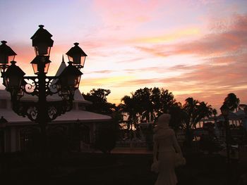 Statue against sky at sunset