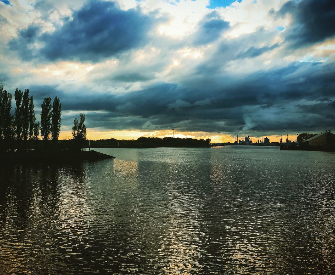 VIEW OF STORM CLOUDS OVER LAKE