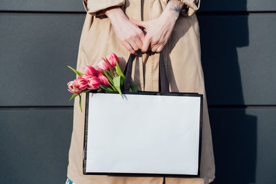 Midsection of woman holding gift box