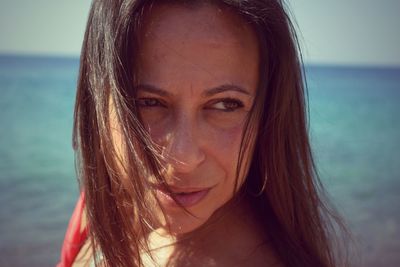 Close-up of young woman on beach