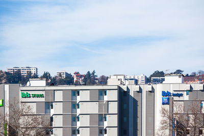 Buildings in city against sky