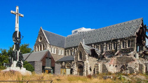 Panoramic view of old building against clear blue sky