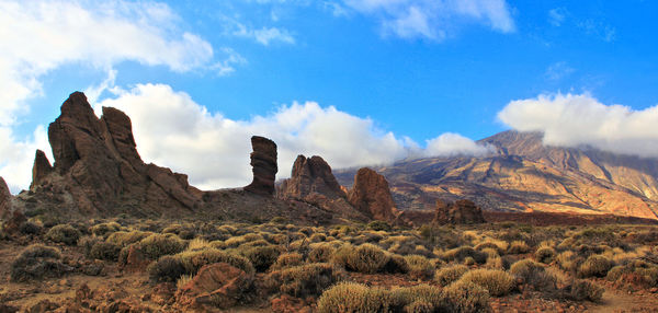 Panoramic view of landscape against cloudy sky