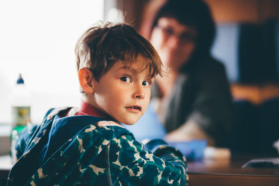 Portrait of boy sitting in train