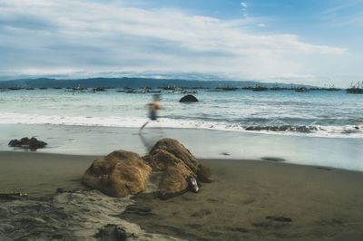 View of calm beach against the sky