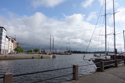 Sailboats sailing in sea against sky