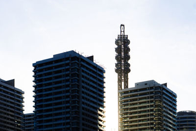 Low angle view of buildings against sky in city