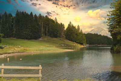 Scenic view of lake against sky during sunset