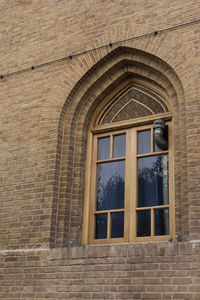 Low angle view of window of old building