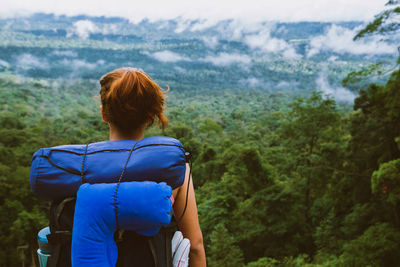 Rear view of woman looking at mountains