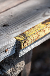 High angle view of rusty metal on wood