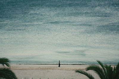 View of calm beach against the sky