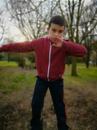 Full length of a boy standing on field