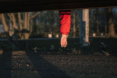 Low section of person running on street