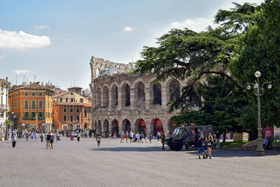 People at town square against sky