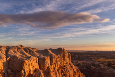 Panoramic view of rock formations against sky during sunset