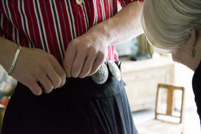 Rear view of people holding hands