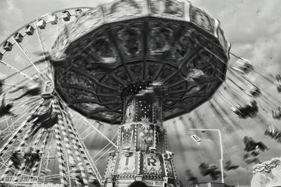 Low angle view of ferris wheel against sky