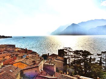 Scenic view of sea with mountain range in background