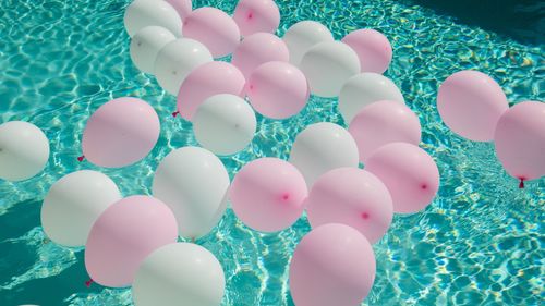 High angle view of balloons floating on swimming pool