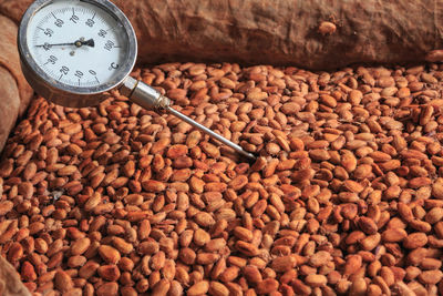 High angle view of clock on cutting board