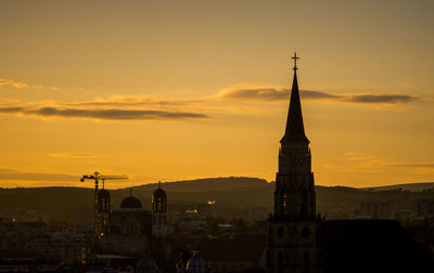 Sunrise over the morning horizon of medieval part of cluj city.