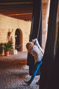 Man standing in curtain