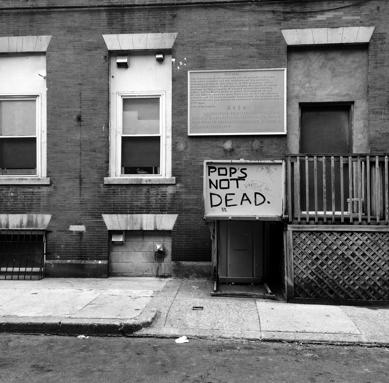 architecture, built structure, building exterior, text, western script, communication, window, door, wall - building feature, graffiti, closed, building, abandoned, wall, day, house, outdoors, no people, capital letter, information sign