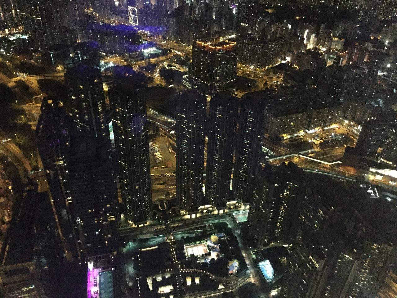 illuminated, cityscape, city, architecture, building exterior, built structure, night, no people, high angle view, building, office building exterior, skyscraper, modern, transparent, city life, aerial view, glass - material