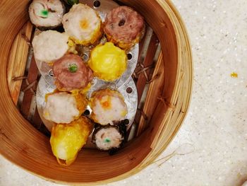 High angle view of eggs in basket on table