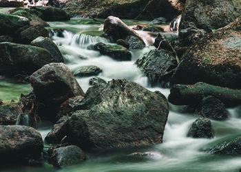 Water flowing through rocks in sea