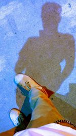 Low section of woman standing on tiled floor