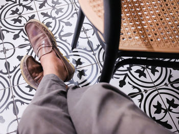 Low section of woman standing in car