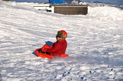 Man on snow covered field