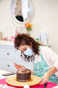 Girl holding ice cream at home