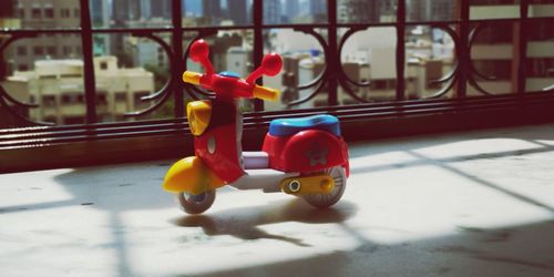 Close-up of toy car against window