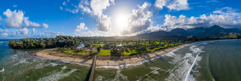 Aerial panoramic image off the coast over hanalei bay and pier on hawaiian island of kauai 