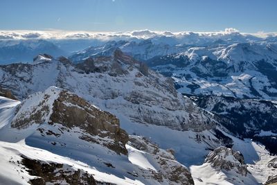 Scenic view of snowcapped mountains against sky