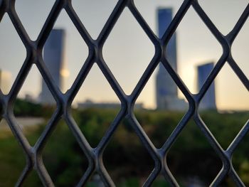 Full frame shot of chainlink fence against sky