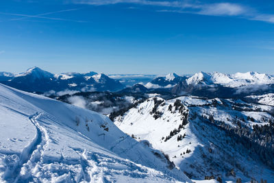 Scenic view of snow covered mountains