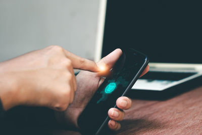 Close-up of hand using mobile phone