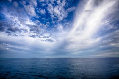 Scenic view of sea against cloudy sky