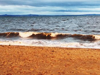 Scenic view of beach against sky