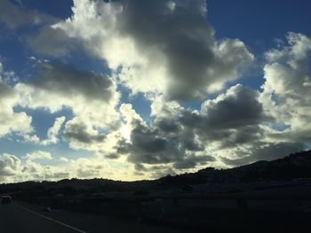 Scenic view of landscape against cloudy sky