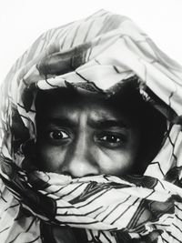 Close-up portrait of teenage girl covering face