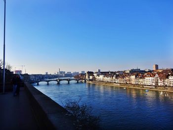 View of bridge over river against blue sky