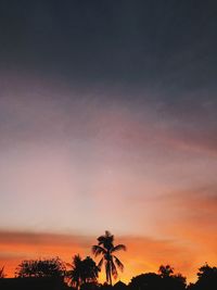 Silhouette trees against sky during sunset
