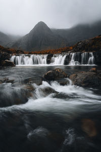 Bridge over waterfall