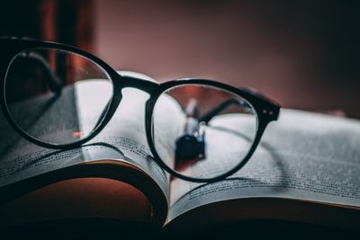 Close-up of eyeglasses on book